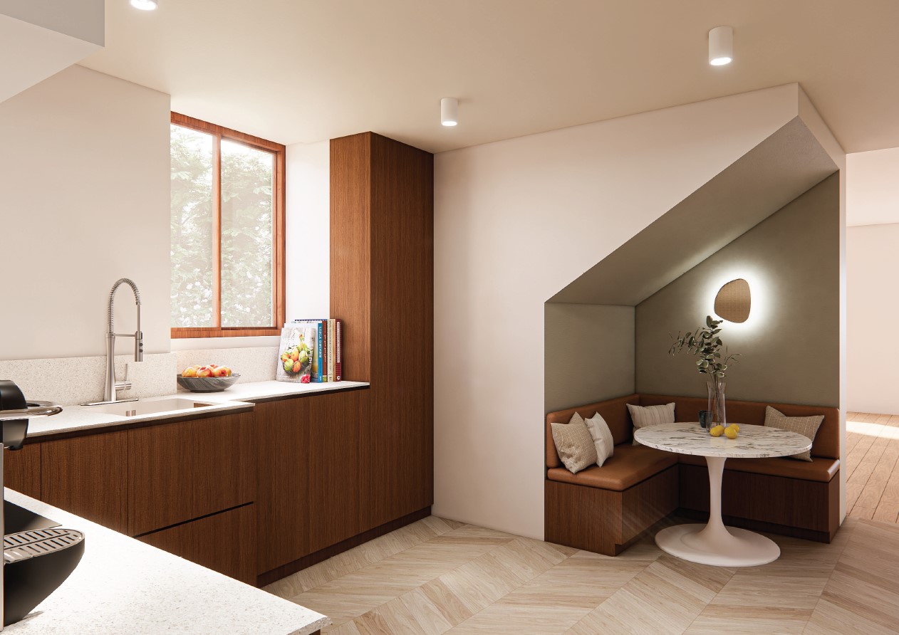 Cuisine moderne avec coin repas en bois, fenêtre éclairant l'espace.